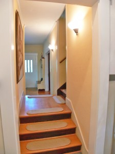 Stairway entrance to the spacious second floor.