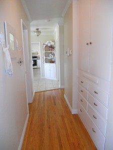 Bright hallway leading from bedrooms to foyer.