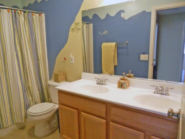 Upstairs hallway bathroom with double vanity (custom "under the sea" mural). 18894 Chatfield Dr., Riverside