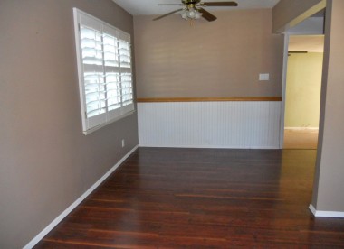 Formal dining room with plantation window shutters and ceiling fan light. 4734 Rubidoux Ave., Riverside