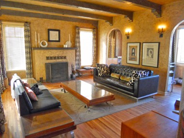 Breathtaking sunken living room with all original custom plaster walls, exposed ceiing beams, large windows and impressive fireplace! 3105 Pine St., Riverside