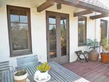 Continuation of large deck off the back of the house. The French doors lead to the formal dining room. 3105 Pine St., Riverside