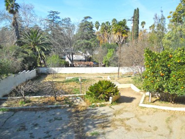 View from deck of 4-level backyard, complete with original navel orange and lemon trees, and pomegranate, apricot and olive. Enclosed with stucco block and wrought iron fencing. 3105 Pine St., Riverside