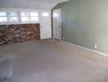 Bonus room (converted breezeway) off the kitchen with separate entrance door, and doorway to convenient attached garage. There's also a newer glass slider to the covered patio. 4734 Rubidoux Ave., Riverside