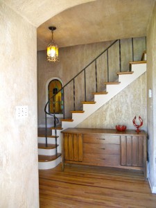 View of open stairway as you walk thru the front door. Note the original switch plate to the left, original light fixture, and hardwood floors! 3105 Pine St., Riverside