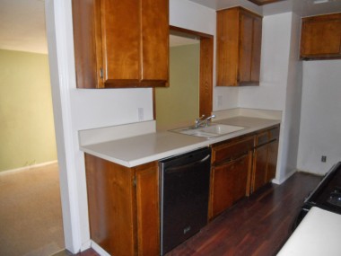 Alternate view of kitchen with pass-through and step-down doorway to bonus room. 4734 Rubidoux Ave., Riverside