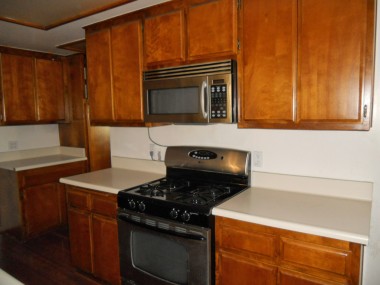 Kitchen with stove and built-in microwave. 4734 Rubidoux Ave., Riverside