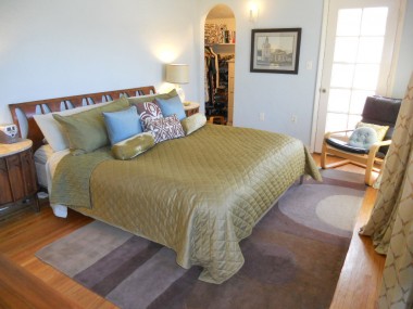 Alternate view of master bedroom with entrance to walk-in closet with built-in chest of drawers and window. 3105 Pine St., Riverside