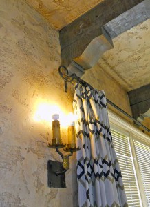 One of the many original sconce lighting fixtures, as well as original curtain rod and brackets! Also note the original and unique textured plaster walls throughout the home. 3105 Pine St., Riverside