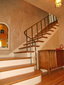 Elegant open stairway with original iron banister, wood, stained glass window and light fixture! 3105 Pine St., Riverside
