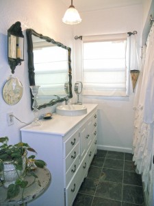 Lovely remodeled bathroom with newer vanity, sink, flooring, and tiled tub enclosure. 4081 Larchwood Pl., Riverside