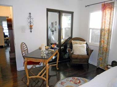 Alternate view of front bedroom with mirrored wardrobe doors and view down the hallway to master bedroom. 4081 Larchwood Pl., Riverside