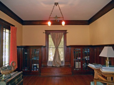 The parlor is to the left as you walk through the front door. Gorgeous original hardwood floors, crown molding and built-in shelving. A grand piano would fit perfectly in this room!
