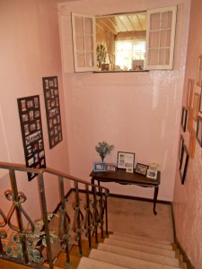 Stairway with window to sitting area adjacent to one of the bedrooms.