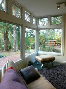 The lovely wall of windows overlooking the backyard. This home feels like an artist's retreat.