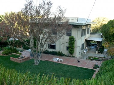 Alternate view of back of home (taken from driveway up above). 