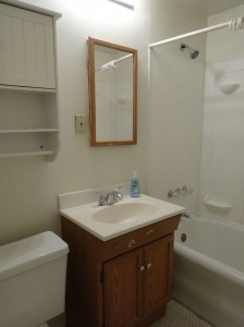 Right side bathroom with newer vanity and toilet. 