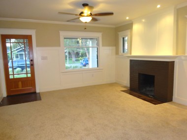 Front entrance and wood-burning fireplace. Recessed lighting, ceiling fan, new carpet.