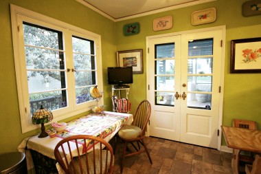 Nook area with original French doors leading to front patio for year-round Southern California al fresco dining.