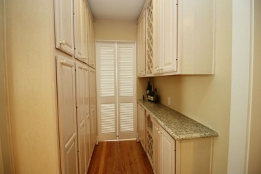 Butler's pantry with doors leading to front parlor.