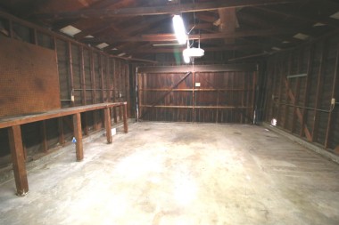 Attached 2-car garage with laundry, work bench, and direct house access.