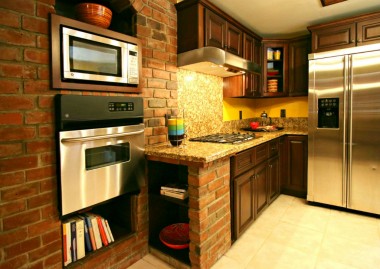 Built-in display shelving for recipe books and/or decorative bowls. Self-closing cabinetry. Refrigerator does not stay.