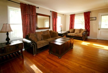 Living room with original hardwood floors. 