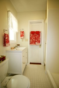 Second remodeled bathroom with shower, newer vanity, and built-in linen cabinet.
