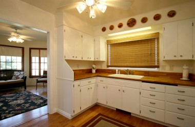 Updated kitchen with newer wood floors, adjacent to family room.