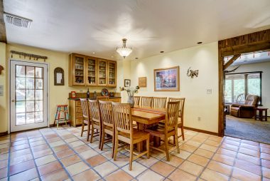 Formal Dining room with built-in hutch and bar sink, with French door leading to side patio for Al fresco dining!