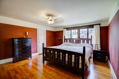 Master bedroom with original pine floors.