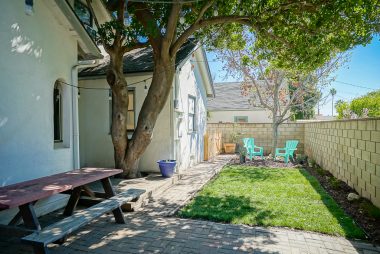 Smaller low-maintenance backyard ideal for relaxing and dining Al fresco anytime of the day, and pretty much year round.