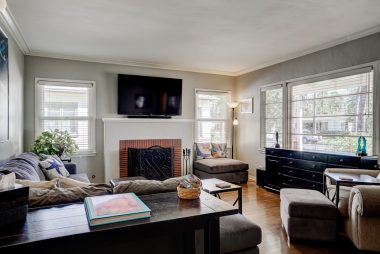 Gorgeous original hardwood floors with gas and wood-burning fireplace, and double pane windows throughout except front picture window and two flanking windows.