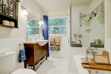 Remodeled bathroom with separate tub and shower.