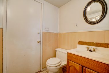 Half bath attached to back bedroom.