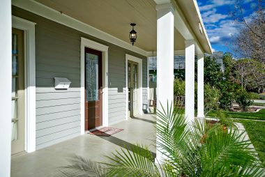 Large covered front porch, complete with swing.