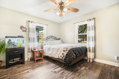 The secondary bedrooms are just a tad smaller than the master, but just as lovely, complete with ceiling fans, gorgeous flooring, and nice closet space.