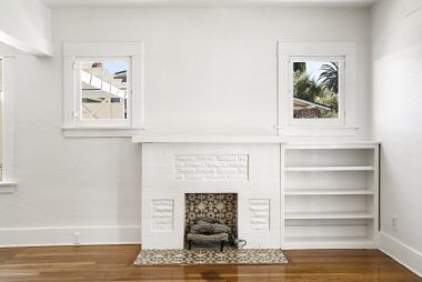 Gas fireplace with built-in display shelves.