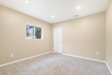 Back bedroom with new carpet, new paint, new recessed lighting, double pane window, and its own walk-in closet!