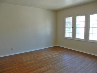 One of the two large bedrooms with original hardwood floors, and spacious closets.