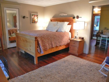 Master bedroom suite with gorgeous hardwood floors, a private bathroom, and a walk-in closet with organizers!