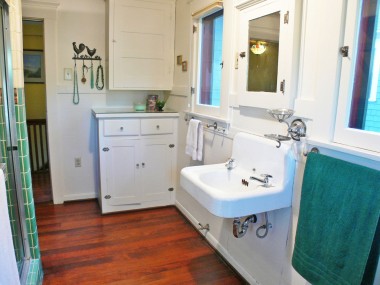 Alternate view of master bathroom showcasing cabinetry for linens, makeup, cleaning supplies, etc.