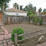Separate rustic-fenced garden area. Fenced area to the right is for RV parking or large toy parking, or remove fence and enlarge usable yard area!