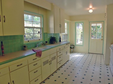 Darling kitchen with original honeycomb tile countertops (historic enthusiasts rejoice!), new gas stove, and indoor laundry.