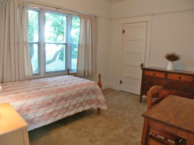 Middle bedroom with spacious closet and cubby area for desk or toy box.