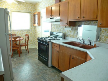 Kitchen was remodeled in the 70's, but it does have a dishwasher, gas stove and casual dining area.
