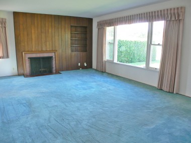 Spacious living room with attached dining area. Hardwood floors under carpeting. See the exposed flooring in front coat closet--they're beautiful!