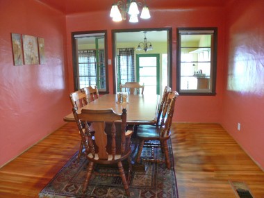 Formal dining room with French doors leading to sun room.