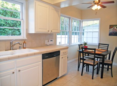 Alternate view of remodeled kitchen with dishwasher, and bright and charming breakfast nook.