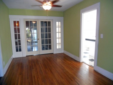 Formal dining room with French doors that separate this room from the bonus room.